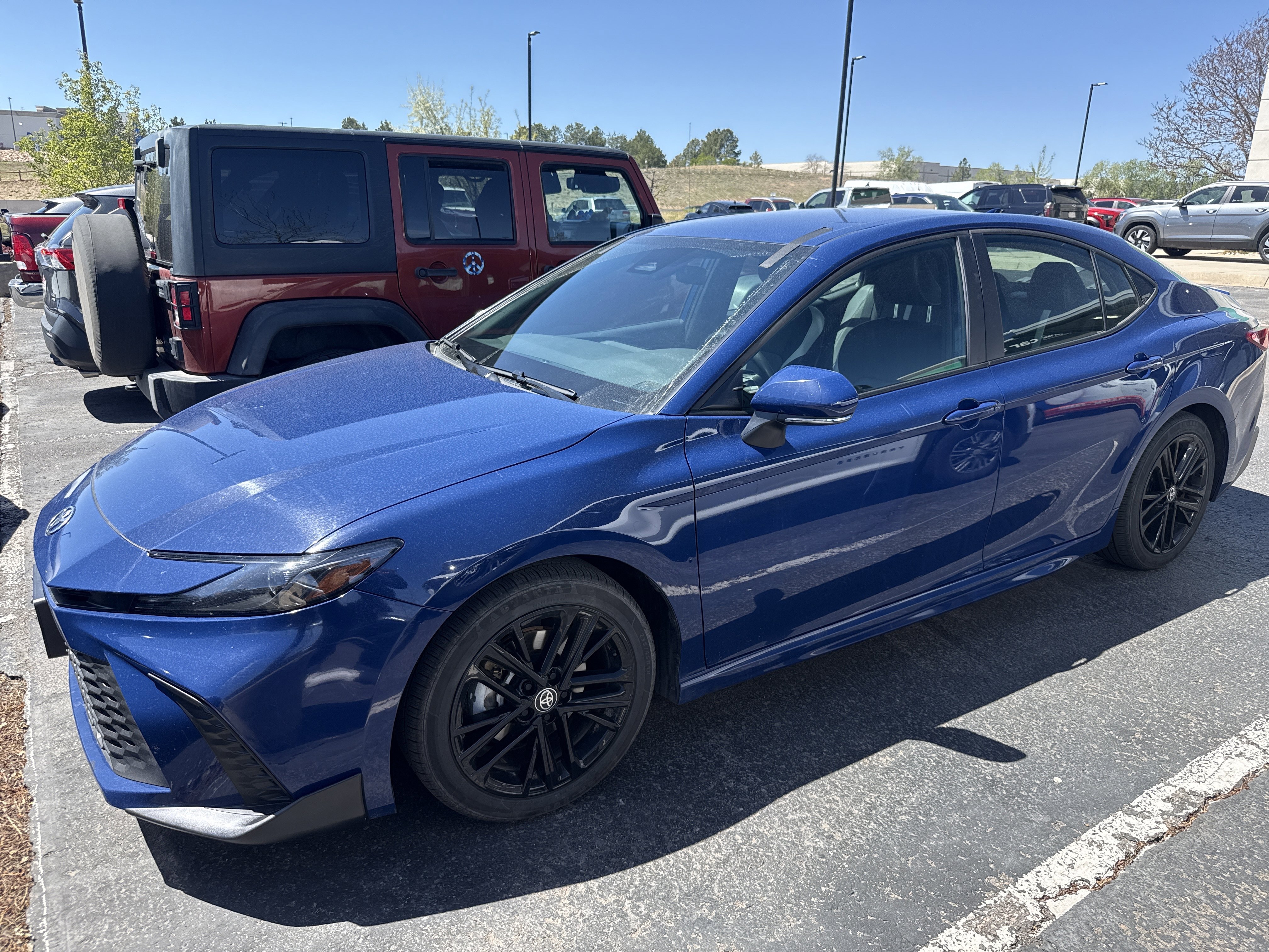 2025 Toyota Camry SE — front three-quarter view
