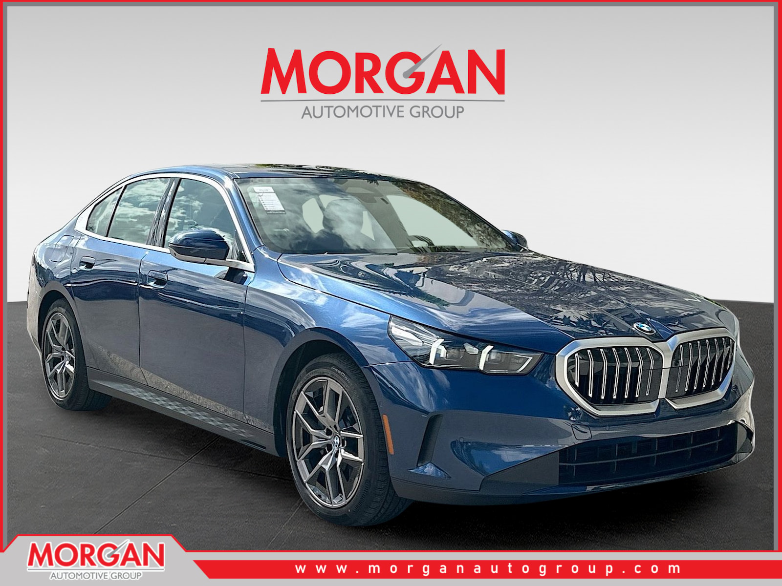 2026 BMW 5 Series 530i in Blue Metallic — front three-quarter view