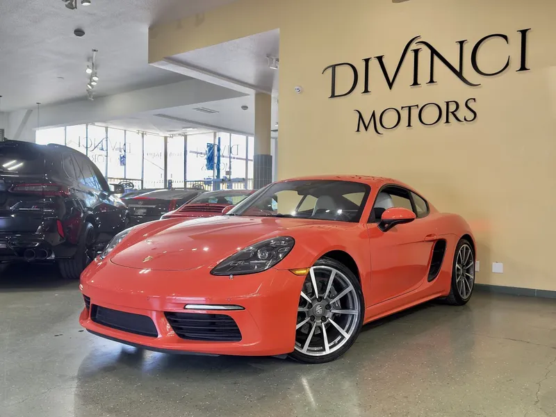 2017 Porsche 718 Cayman in Orange — front three-quarter view