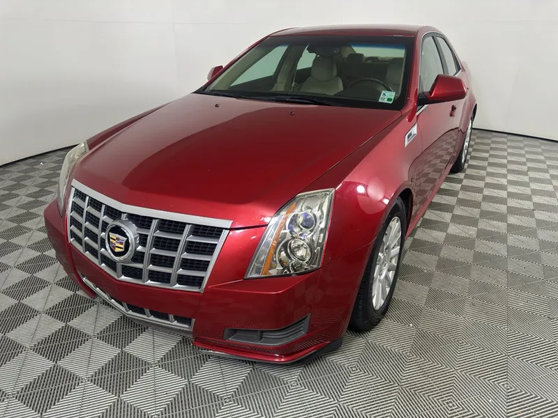 2013 Cadillac CTS Luxury in Crystal Red Tintcoat — front three-quarter view