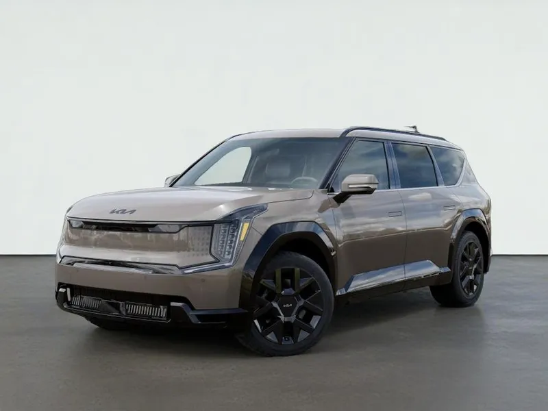2026 Kia EV9 LAND in Road Rider Brown — front three-quarter view