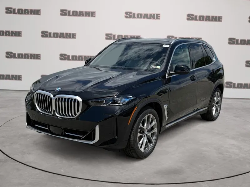 2026 BMW X5 xDrive50e in Black Sapphire Metallic — front three-quarter view