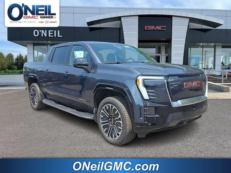 2026 GMC Sierra EV Denali Standard Range in Deep Ocean Metallic — front three-quarter view