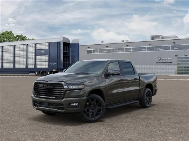 2026 RAM Ram 1500 RAM 1500 LARAMIE CREW CAB 4X4 5'7' BOX in Tank Exterior Paint — front three-quarter view