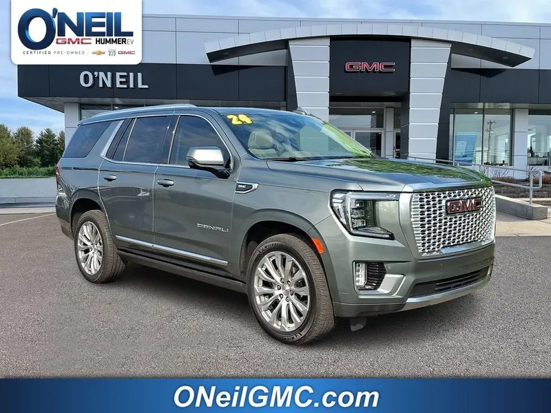 2024 GMC Yukon Denali in Frosted Pine Metallic — front three-quarter view