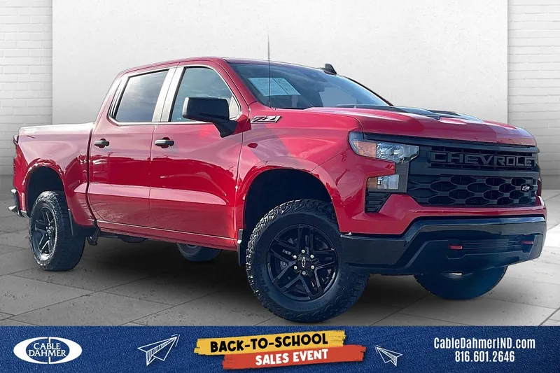 2024 Chevrolet Silverado 1500 Custom Trail Boss in Red Hot — front three-quarter view