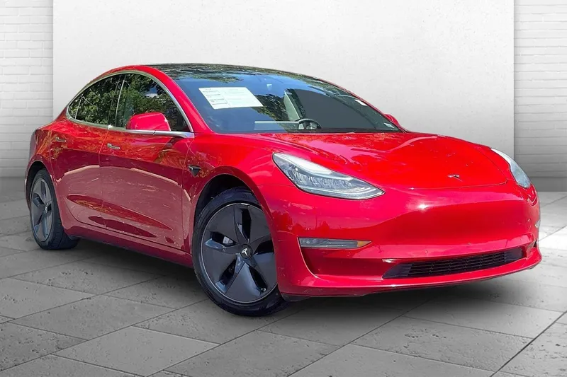 2018 Tesla Model 3 Long Range Battery in Red — front three-quarter view