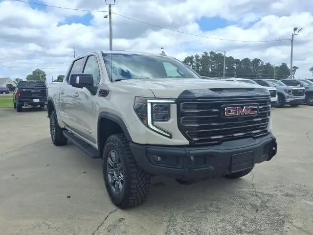 2026 GMC Sierra 1500 AT4X in Coastal Dune — front three-quarter view