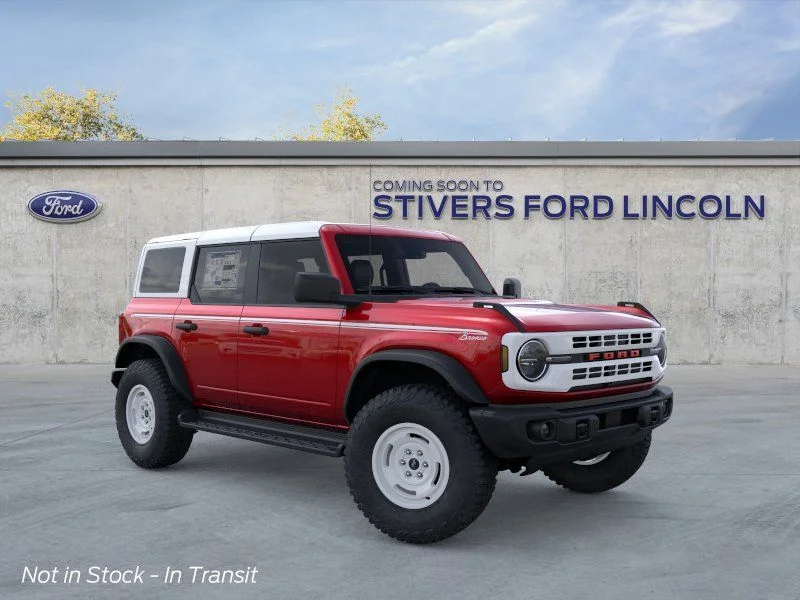 2026 Ford Bronco Heritage Edition in Ruby Red Metallic Tinted Clearcoat — front three-quarter view