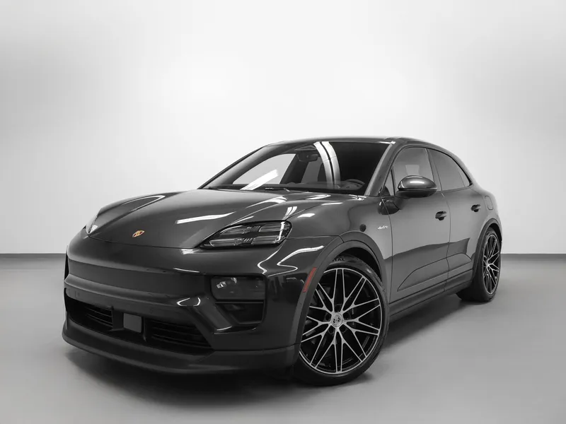 2026 Porsche Macan Macan 4 Electric in Volcano Grey Metallic — front three-quarter view