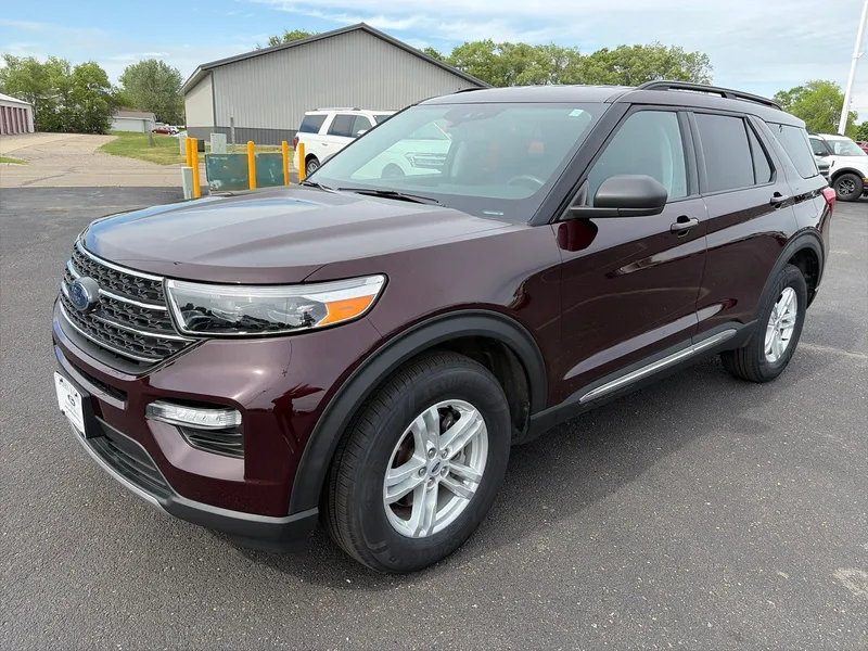 2023 Ford Explorer XLT 4WD in Jewel Red Metallic Tinted Clearcoat — front three-quarter view