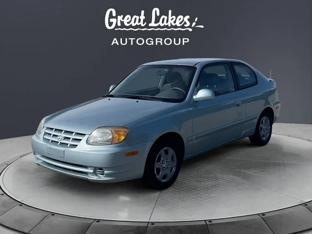 2005 Hyundai Accent GLS in Glacier Blue — front three-quarter view