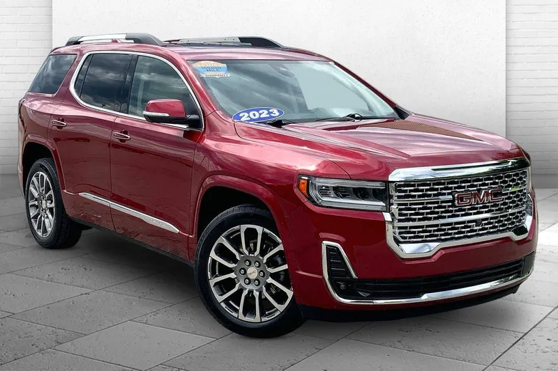 2023 GMC Acadia Denali in Volcanic Red Tintcoat — front three-quarter view