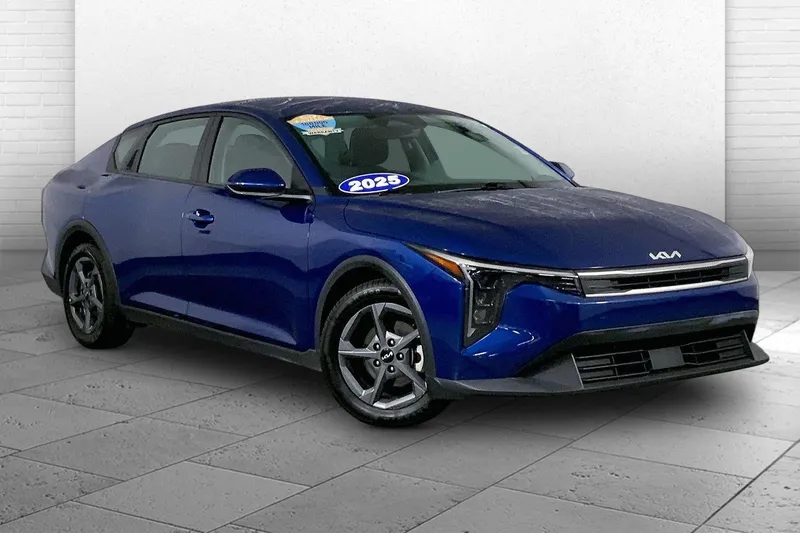 2025 Kia K4 LXS in Deep Sea Blue — front three-quarter view