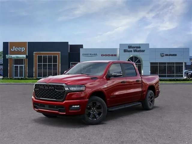 2026 RAM Ram 1500 RAM 1500 BIG HORN CREW CAB 4X4 5'7' BOX in Molten Red Pearl-Coat Exterior Paint — front three-quarter view