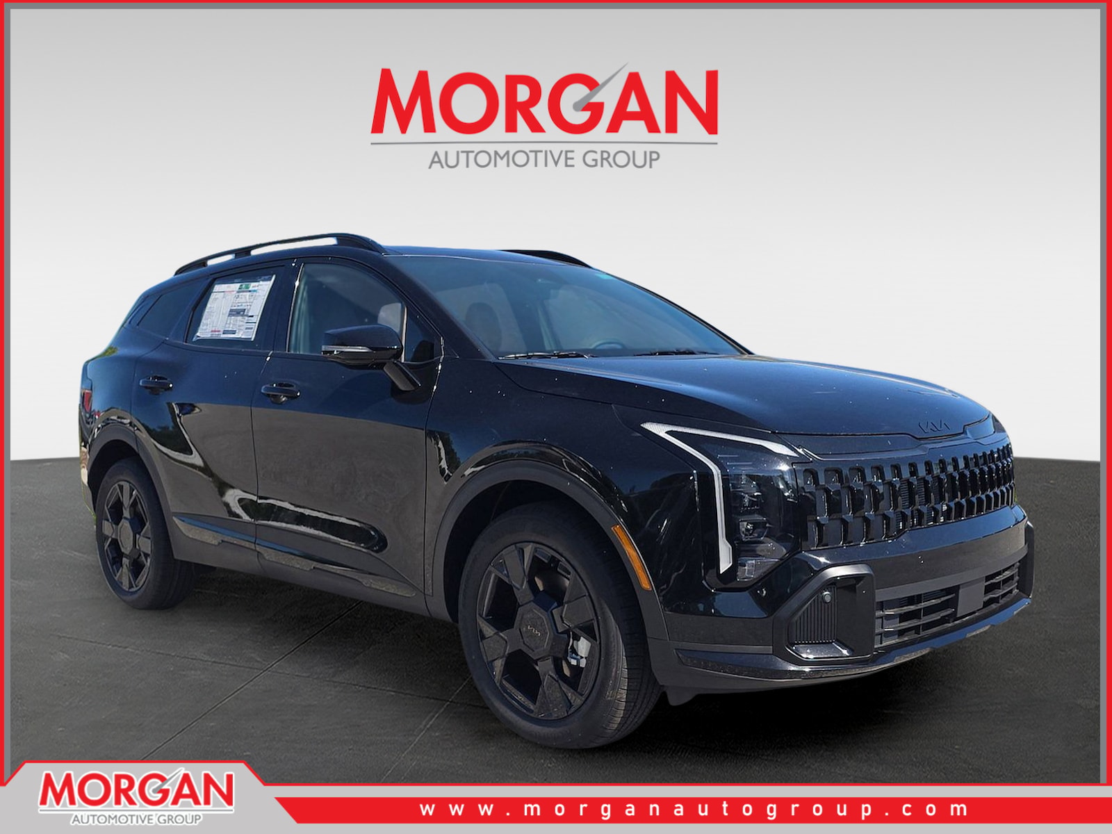 2026 Kia Sportage X-Line in Ebony Black — front three-quarter view