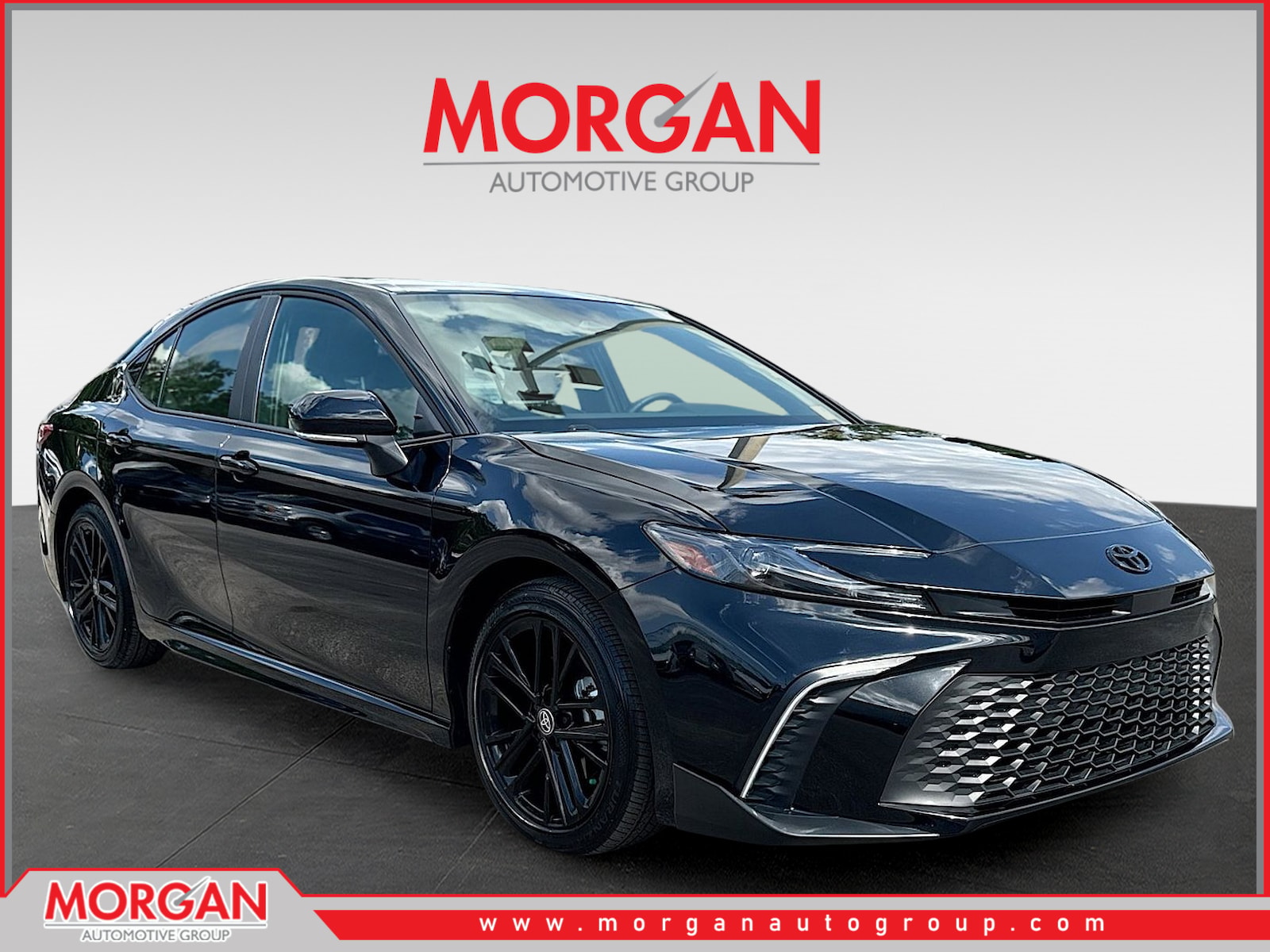 2026 Toyota Camry SE in Midnight Black Metallic — front three-quarter view