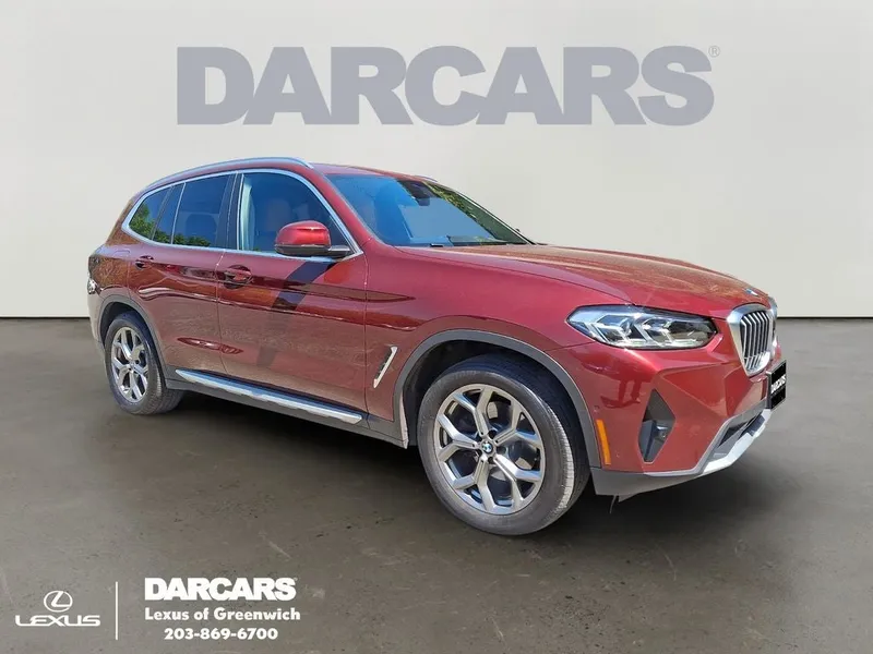 2023 BMW X3 xDrive30i in Aventurin Red Metallic — front three-quarter view