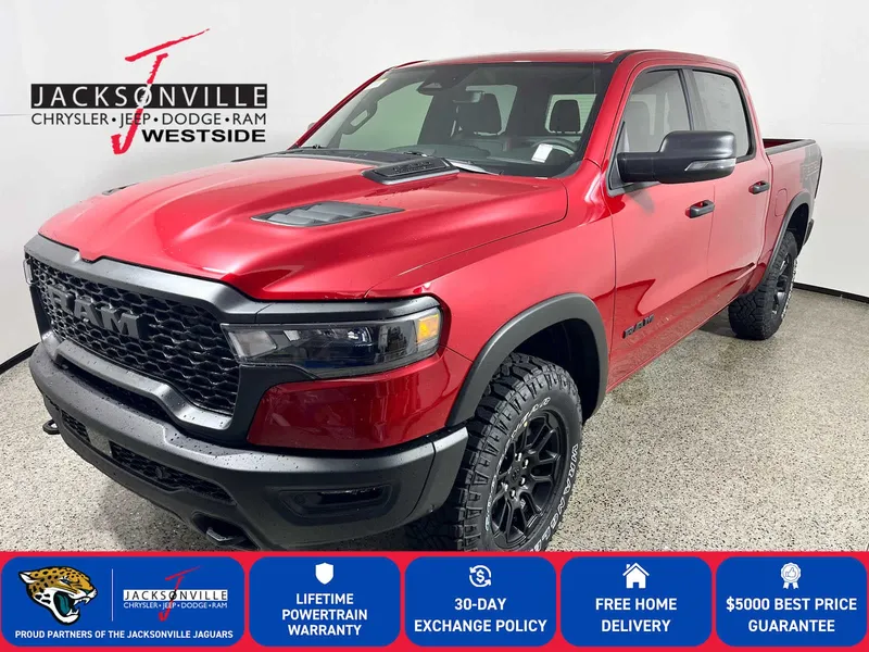 2026 RAM 1500 Rebel in Molten Red Pearl-Coat Exterior Paint — front three-quarter view